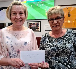 Lynn Hunter from Gray Lodge Dundee receiving £110 from Alice Noble (Treasurer)
